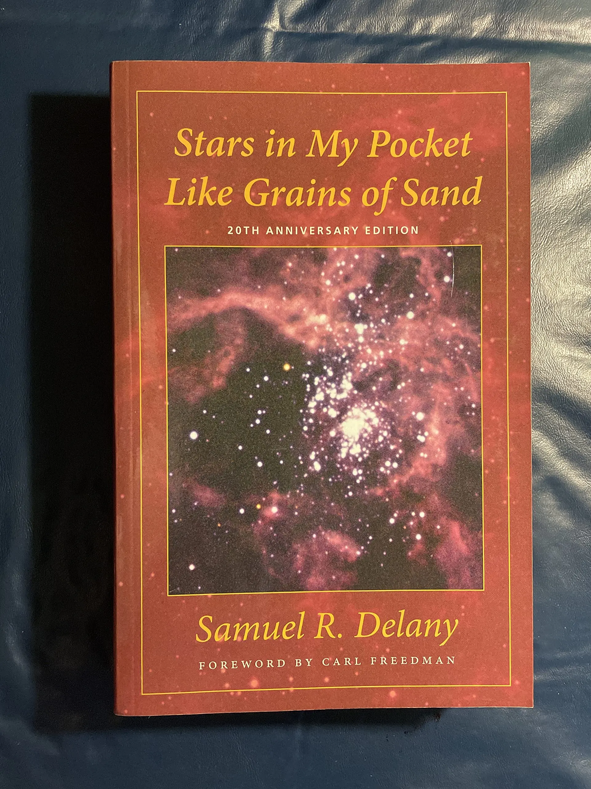 A random splotchy Hubble photo with the title in Times New Roman with a McDonalds color scheme