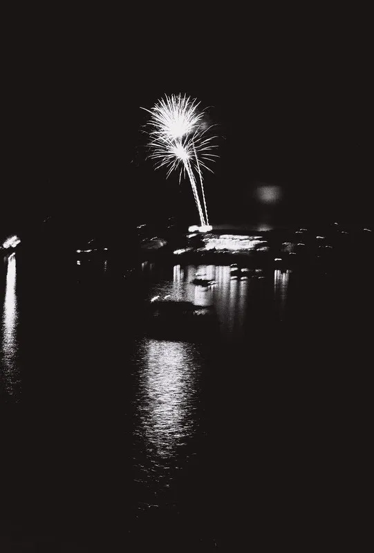 fireworks over water, blurry from shaking