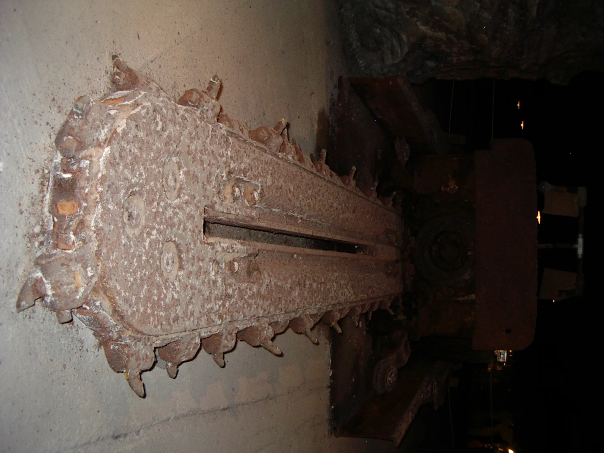 The rusty chain of an 'undercutter', essentially a truck-sized chainsaw used in salt mining