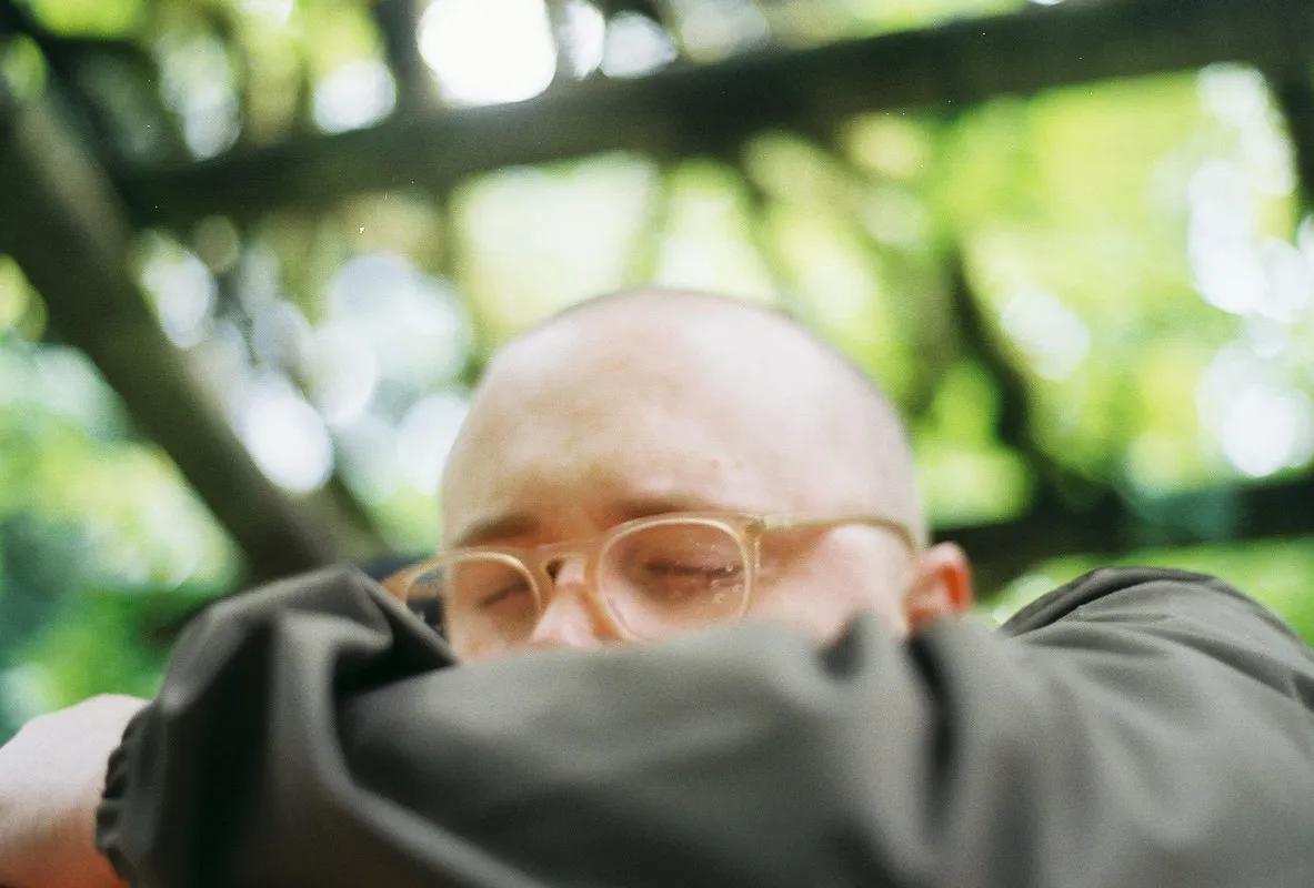nick covering his face