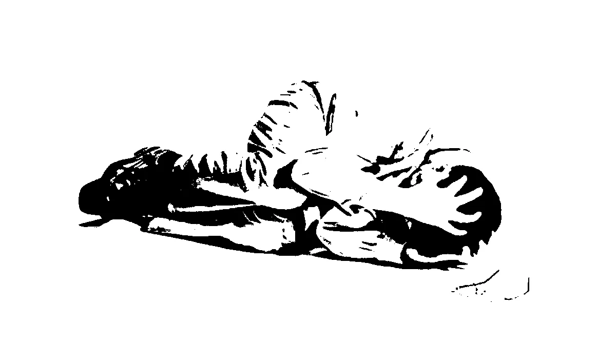 Stock photo of a person in business-casual clothes curled up in the fetal position on the floor of a white void gripping their head