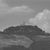 a fortress on a hill in the Tuscan countryside