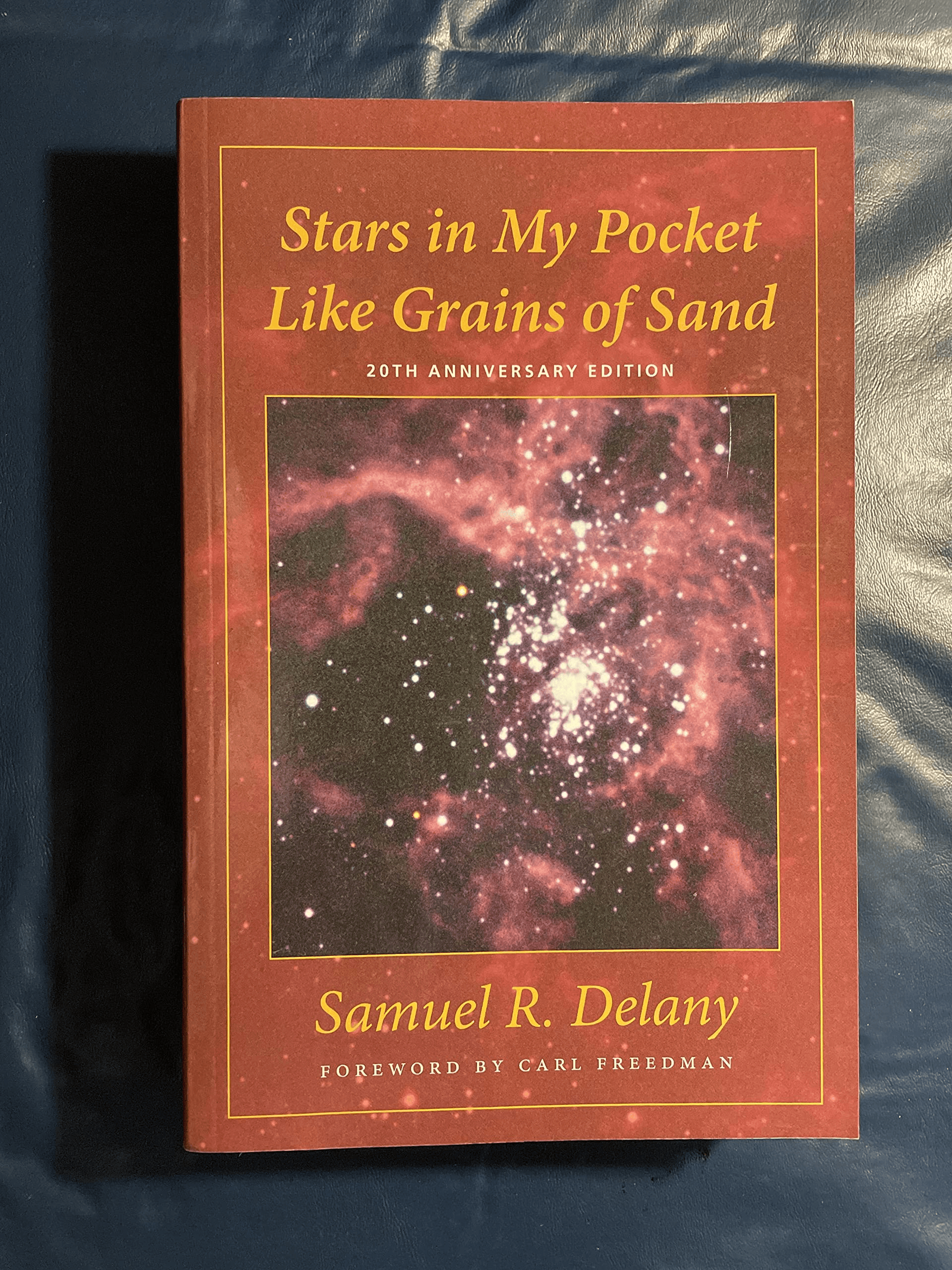 A random splotchy Hubble photo with the title in Times New Roman with a McDonalds color scheme