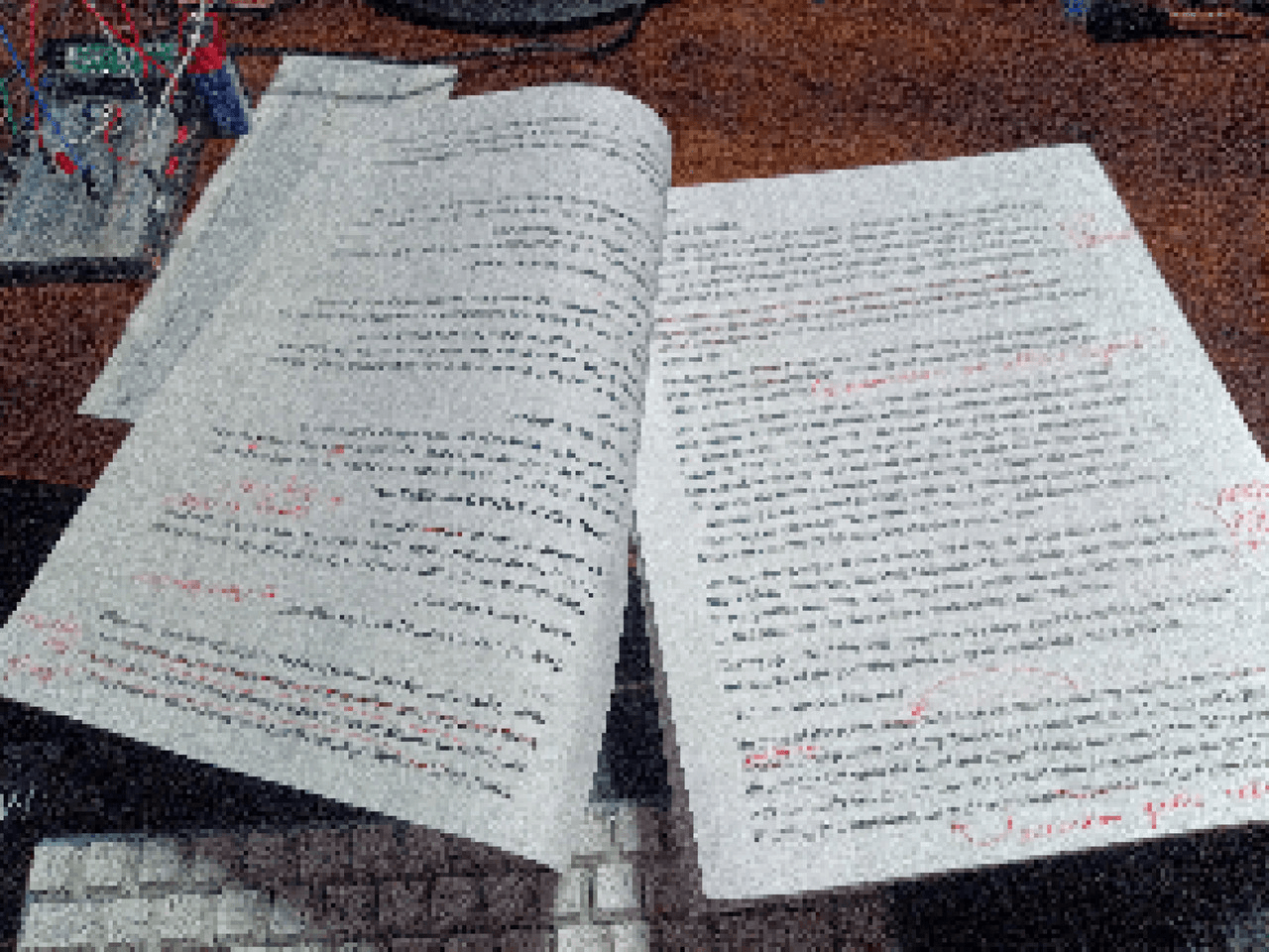 obfuscated document on a desk. my pi pico and breadboard kit make a cameo in the top right corner. hi pi pico