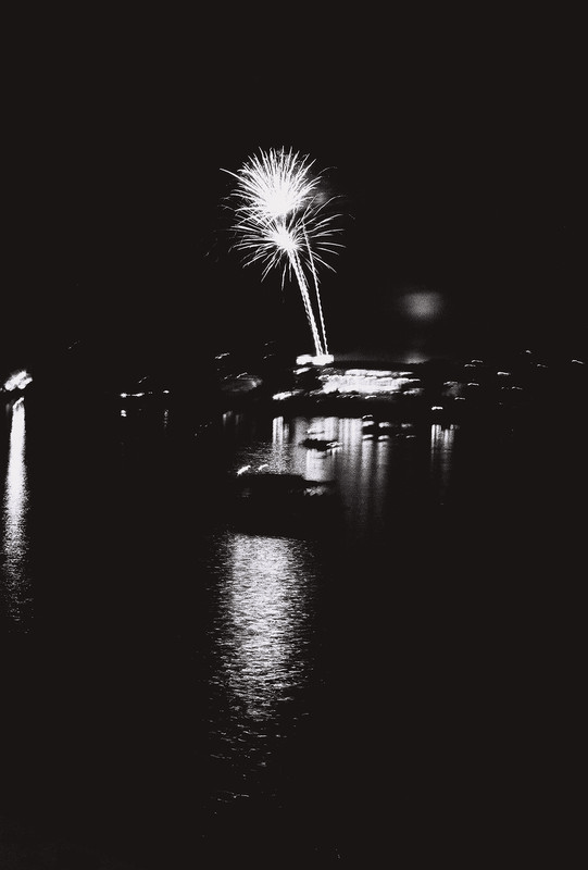 fireworks over water, blurry from shaking
