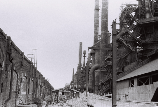 black-and-white photo of a steel mill extending into the distance