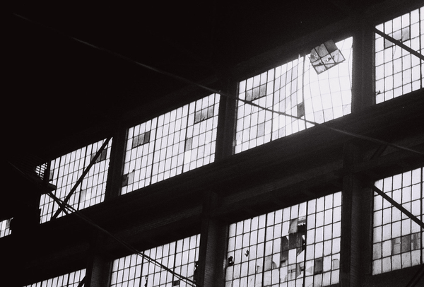 light coming through the windows of a warehouse