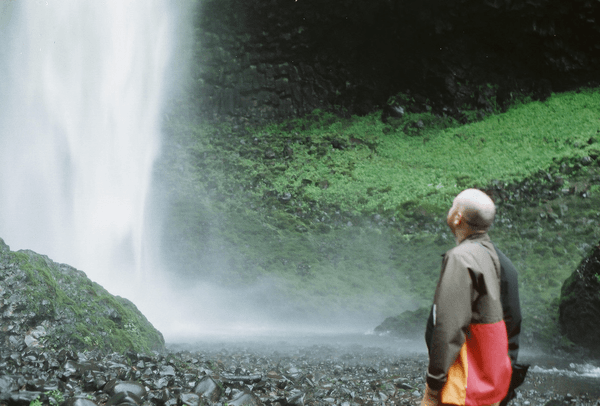 nick looking at a waterfall